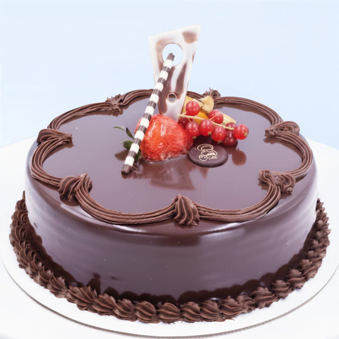 Chocolate Truffle Cake 1 Kg by Mister Baker topped with strawberry, berries, and chocolate garnish