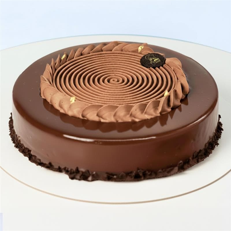 Chocolate Mousse Cake 1 Kg by Mister Baker with creamy mousse layers and glossy chocolate finish.