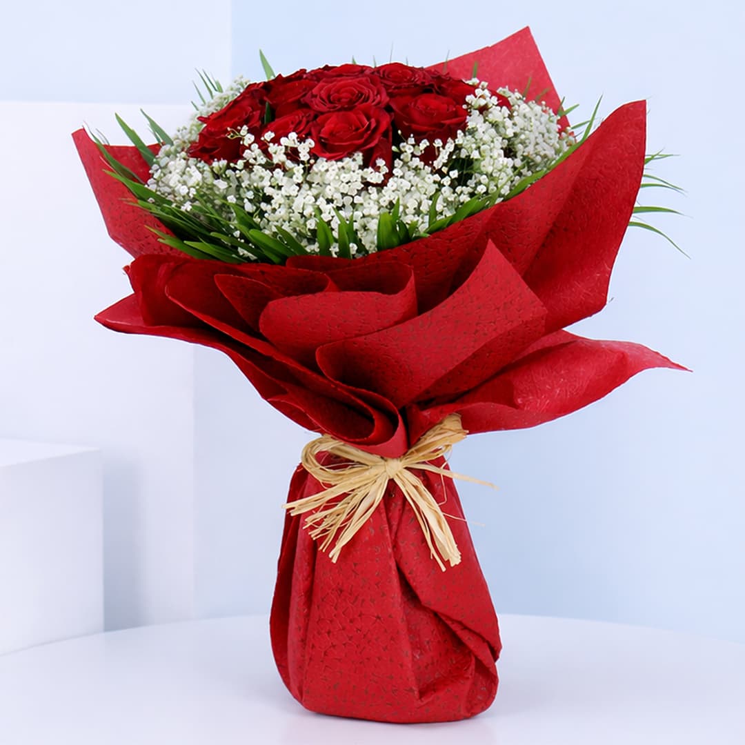 Fresh bouquet of 10 red roses with gypsophila fillers wrapped for Valentine’s Day gifting