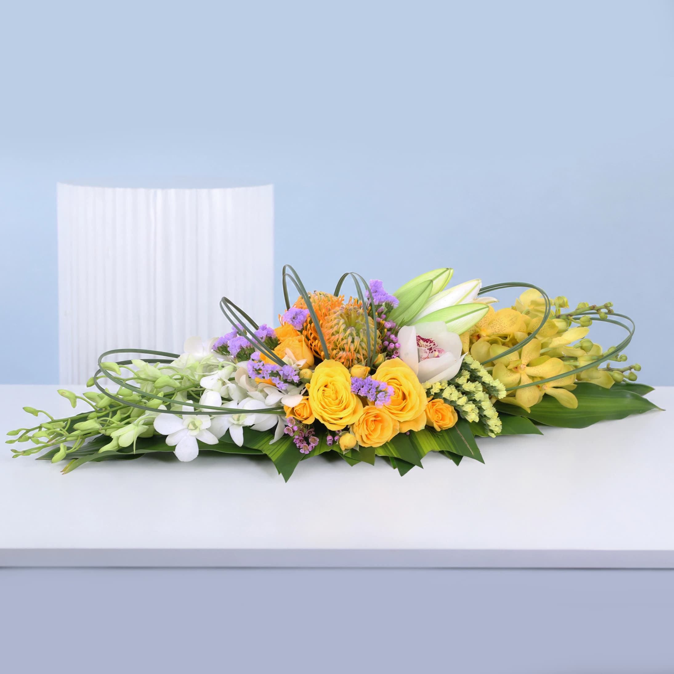 Luxury table centrepiece with layered mixed floral arrangement designed for elegant event décor and premium table styling.